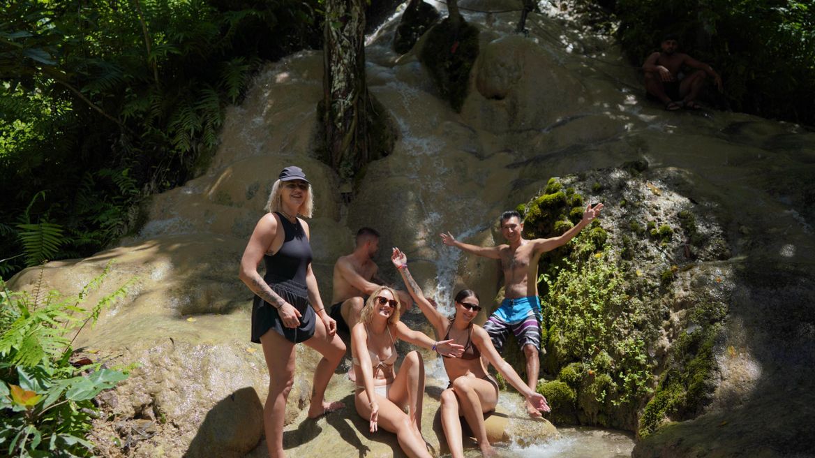 Explore Sticky (But Tong) Waterfall, an interesting local natural feature.