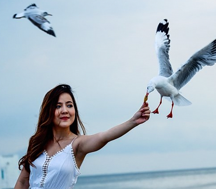 Girl with bird :) They are so close to you