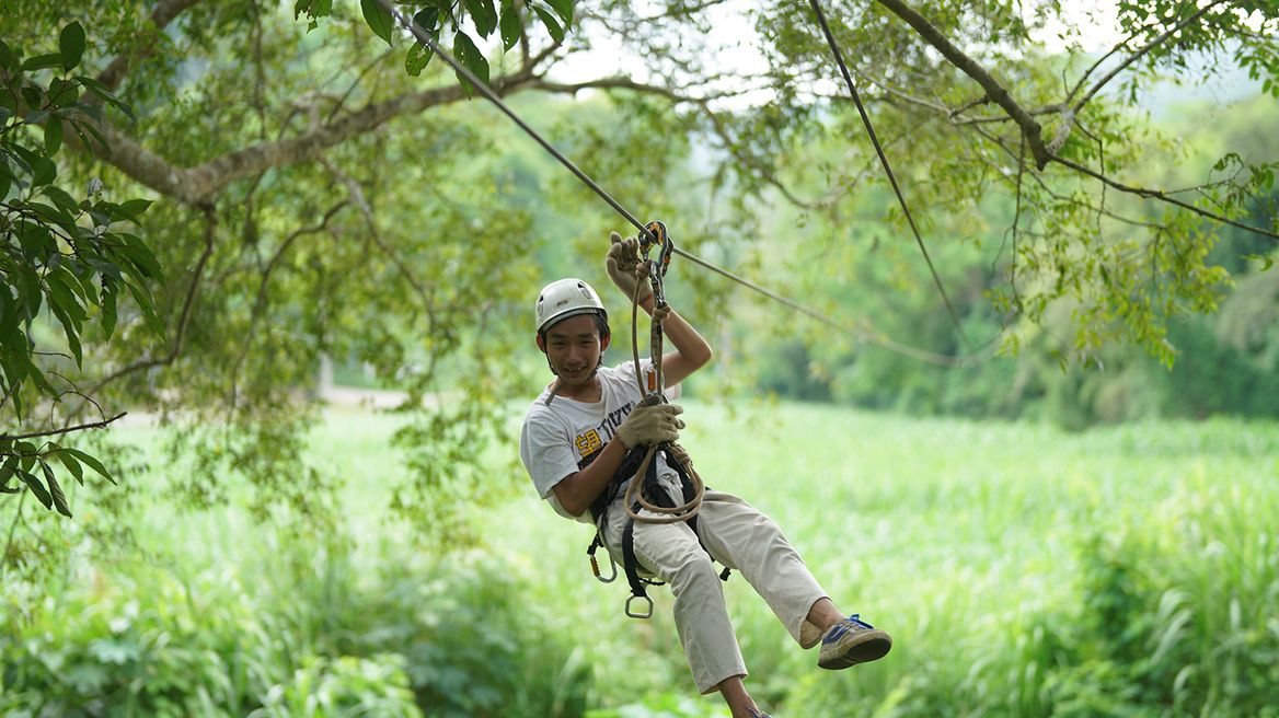 Admire breathtaking views of the lush greenery and the meandering Mae Wang River below.
