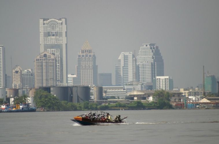 Cross the might Chao Phraya by long tail boat
