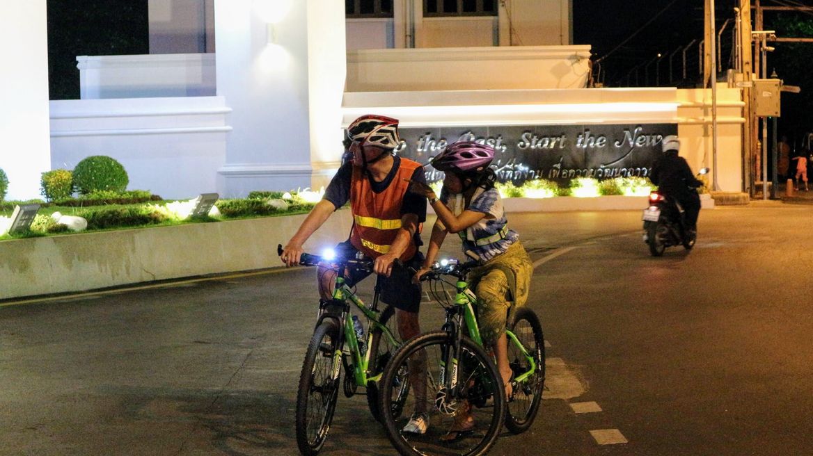 Ride around Bangkok at night with a local guide