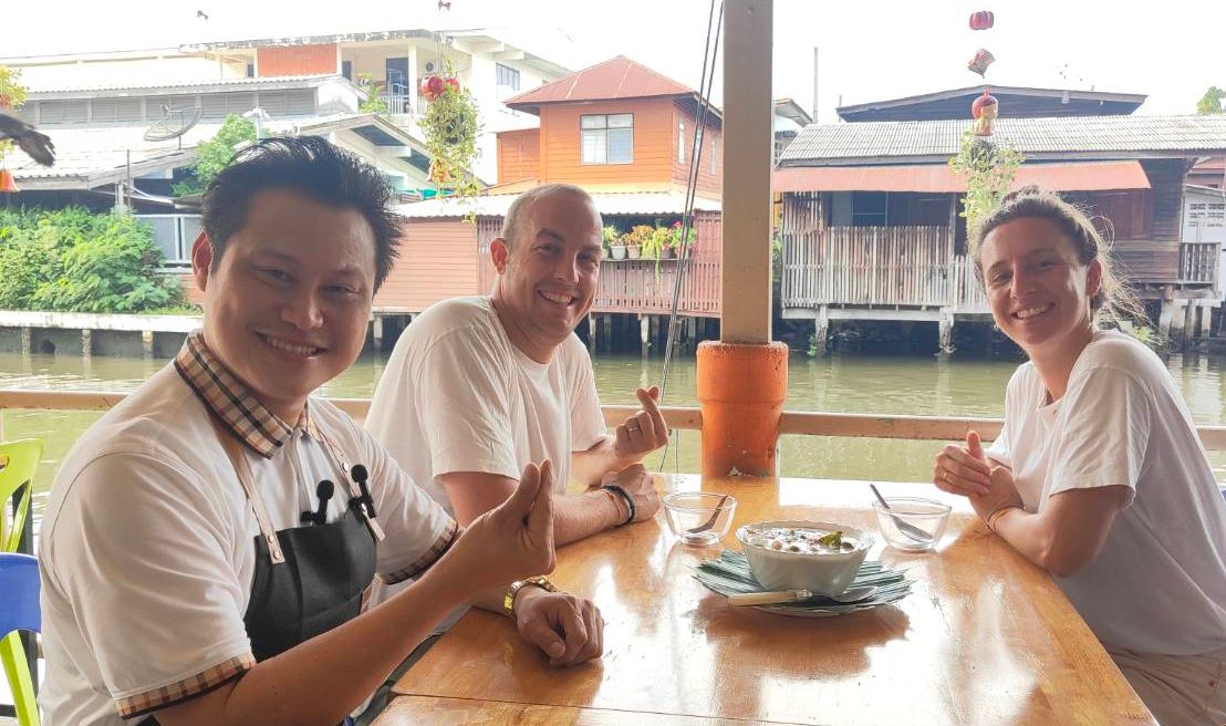 Tourists enjoy with surrounding while having lunch.
