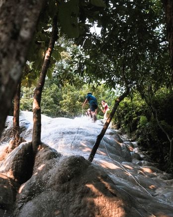 Grab the robes and climb on Bua Tong Waterfalls 